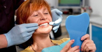Woman smiling with dental implants in Indianapolis.