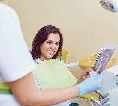 Relaxed dental patient talking to dentist