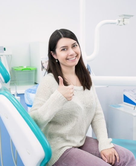 Woman smiling after preventive dentistry visit