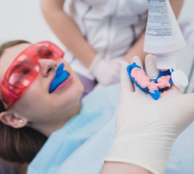 Dental patient receiving fluoride treatment