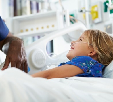 Child smiling during children's dentistry visit