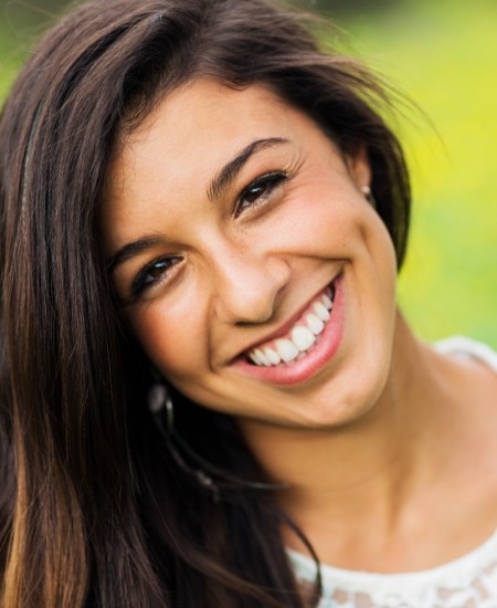 Woman sharing flawless smile after cosmetic dentistry