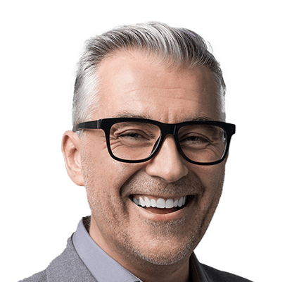 Older man with glasses grinning