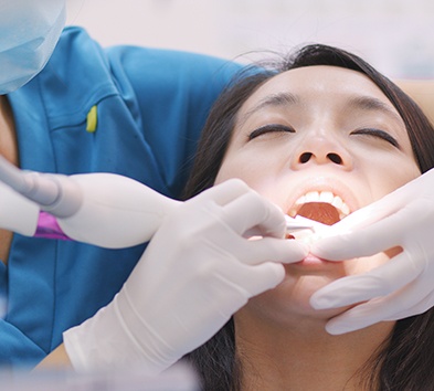 Female patient receiving treatment for gum disease