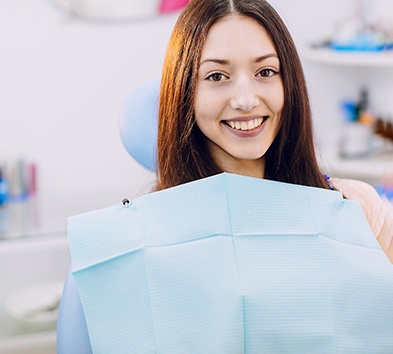 Female dental patient smiling and waiting for dentist