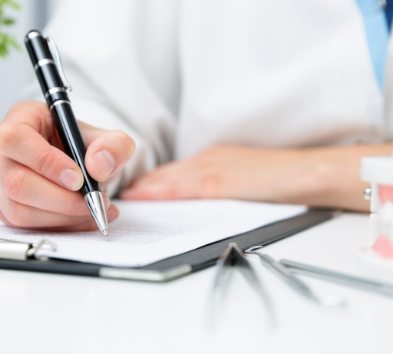 Dental team member reviewing dental insurance information