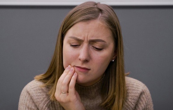 woman in pain in Dover
