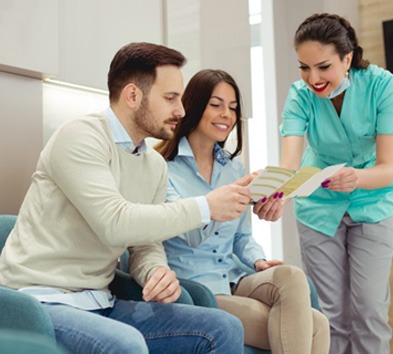 Dentist in Indianapolis talking to patients about a smile makeover