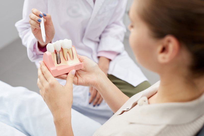A dentist answering how long do dental implants last