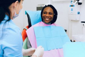 Smiling woman in dentist chair