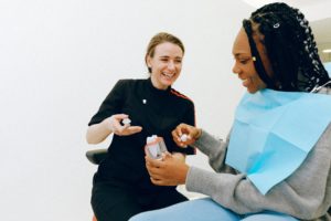 Dentist discussing a dental crown with a female patient